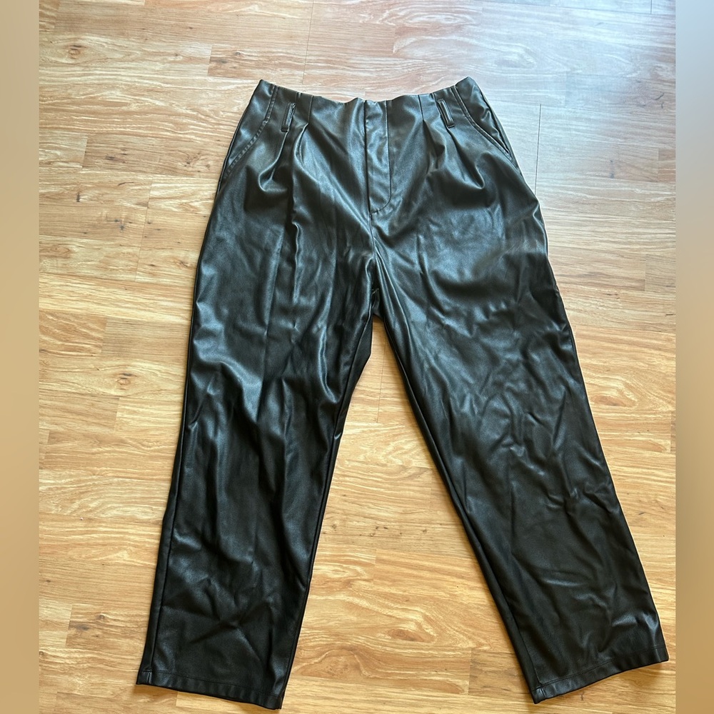 Black leather pants with zipper button closure